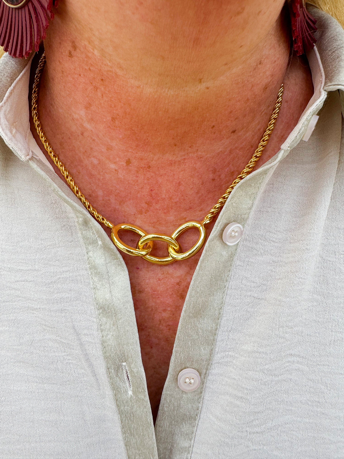 Gold-toned necklace with three statement chain links on a delicate rope chain—elegant, timeless, and made to last.