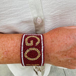 Garnet and gold beaded cuff bracelet featuring the FSU logo, perfect for showing team spirit.