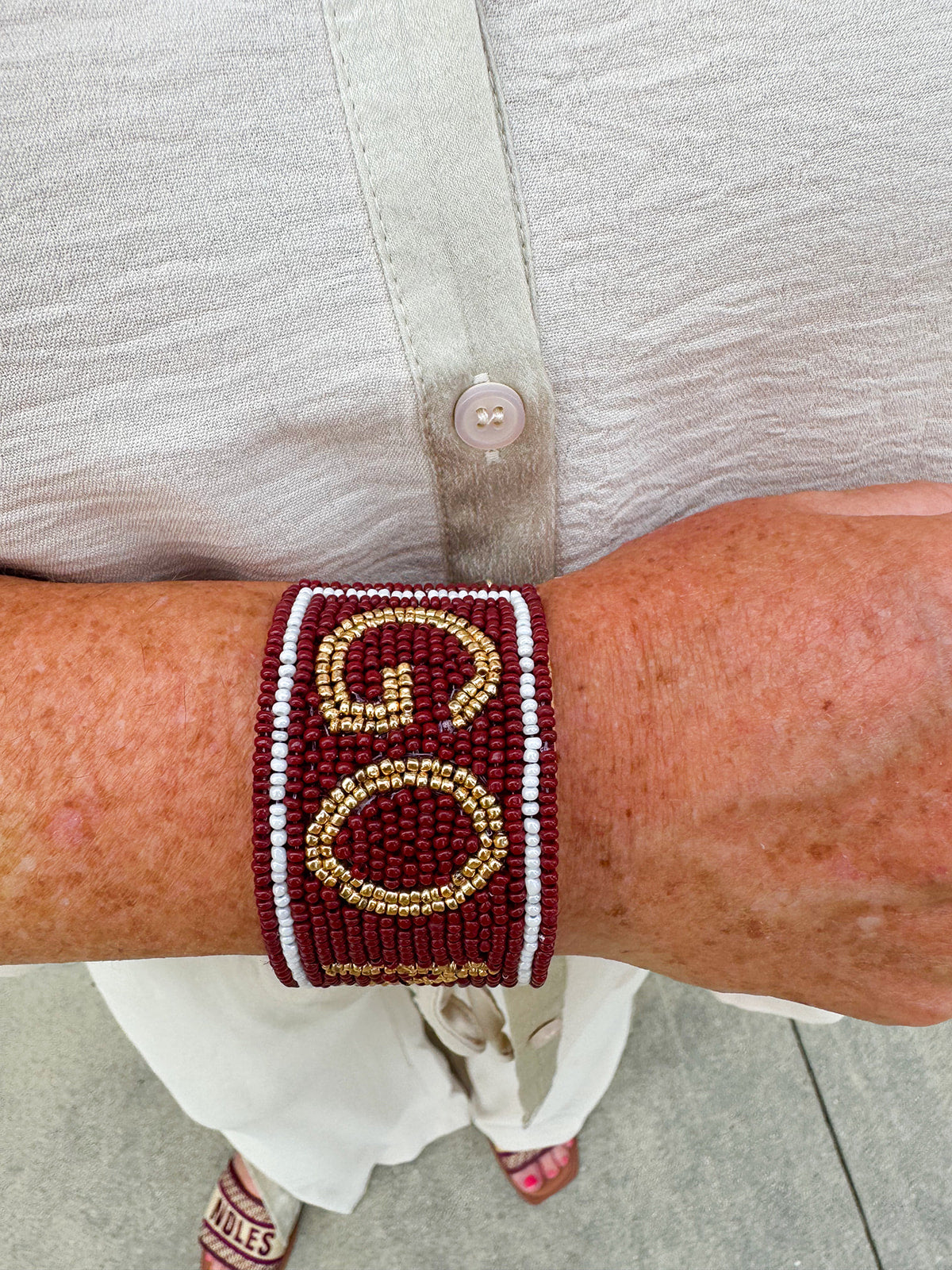 Garnet and gold beaded cuff bracelet featuring the FSU logo, perfect for showing team spirit.
