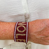 Garnet and gold beaded cuff bracelet featuring the FSU logo, perfect for showing team spirit.