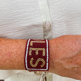 Garnet and gold beaded cuff bracelet featuring the FSU logo, perfect for showing team spirit.