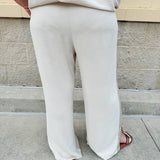 Oatmeal wide leg pants with gold side piping and drawstring waist