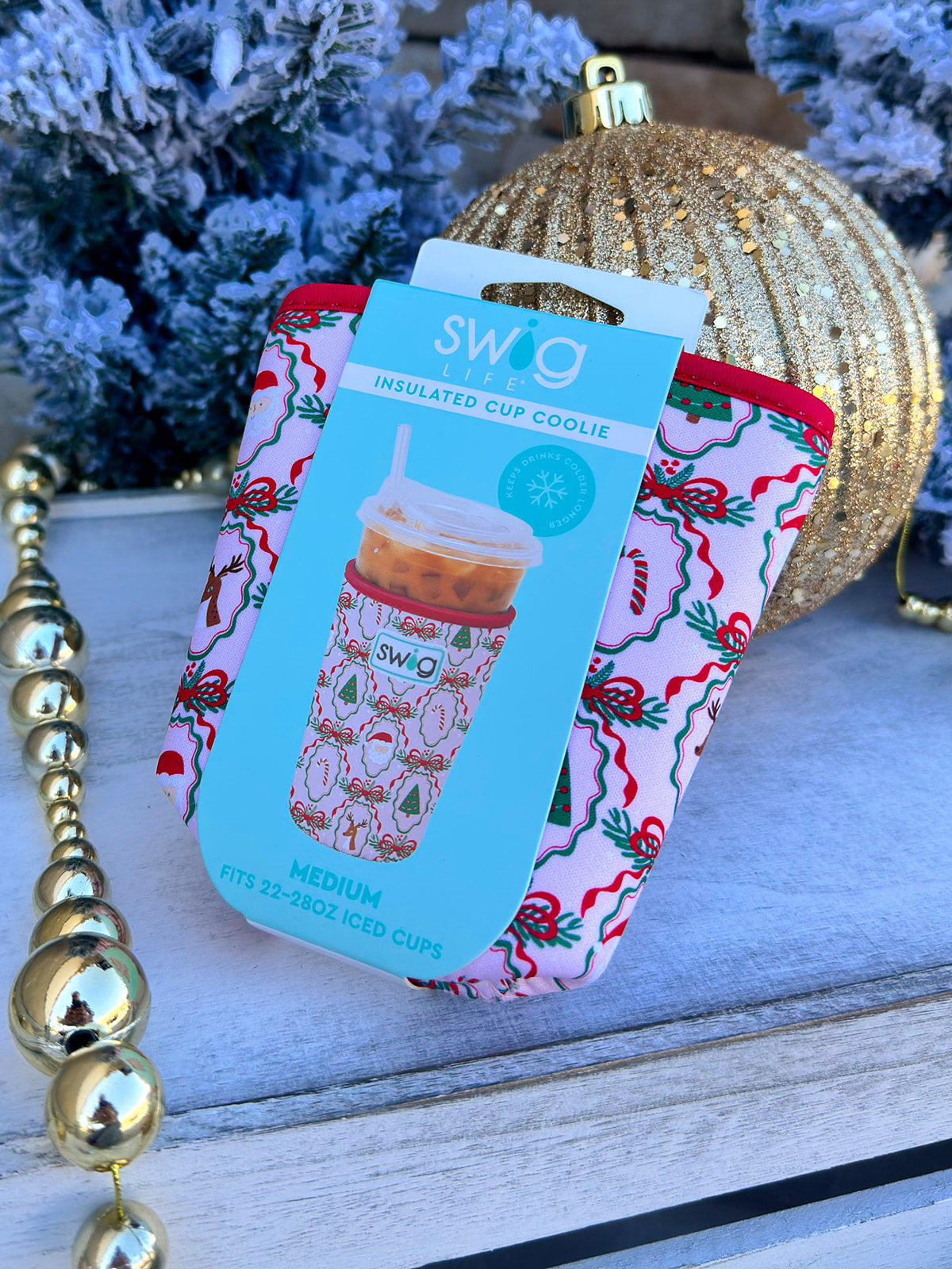 Pink neoprene iced cup Coolie with Christmas cameos and ribbon designs.