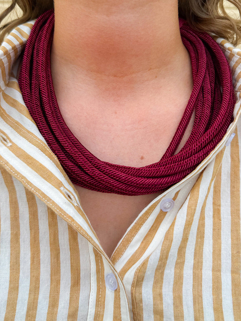 Garnet rope-style necklace with gold hardware and adjustable clasp