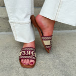 Gold slip-on sandals with garnet “Noles” embroidery and patterned trim