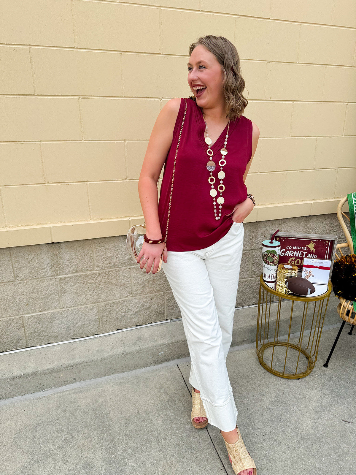 Garnet sleeveless V-neck tank top with pleated neckline detail and a relaxed, lightweight fit—perfect for warm-weather gamedays.