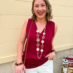 Garnet sleeveless V-neck tank top with pleated neckline detail and a relaxed, lightweight fit—perfect for warm-weather gamedays.
