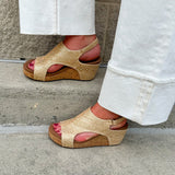 Light gold raffia cork wedges with gold rivets, Velcro heel strap, and a cushioned footbed