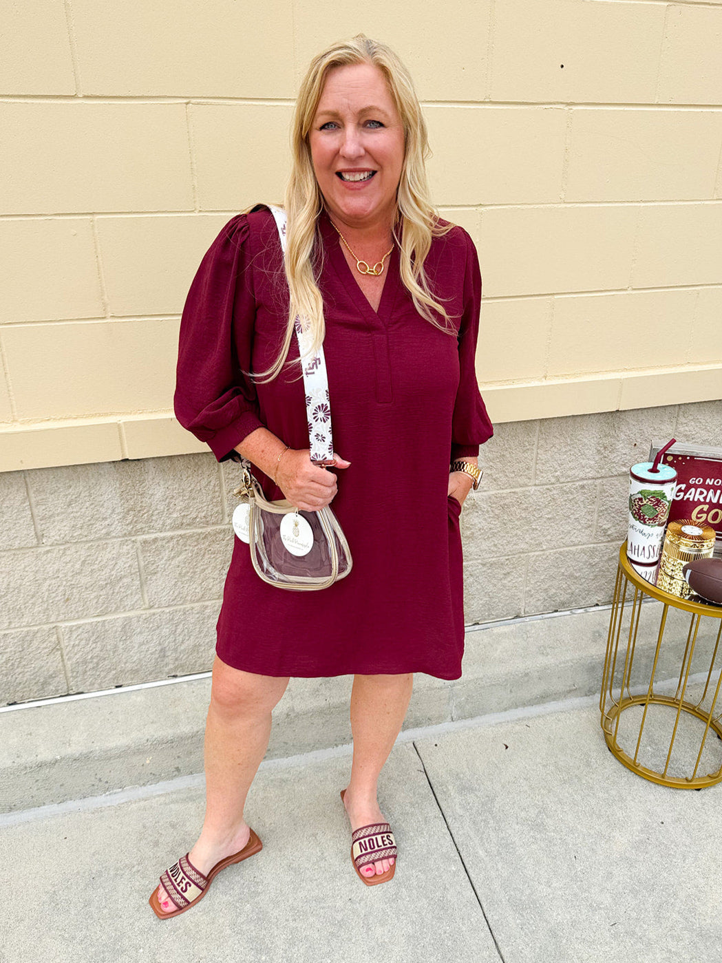 Garnet mini dress with a split U-neckline, flowy fit, and three-quarter peasant sleeves with banded cuffs. Lightweight and perfect for Gameday style.
