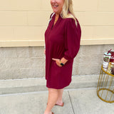 Garnet short sleeve mini dress with deep V-neck, drop shoulders, and side pockets—perfect for gameday.