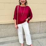 Satin dolman sleeve blouse with a round neckline, shown in a gameday-ready, lightweight and flowy style.