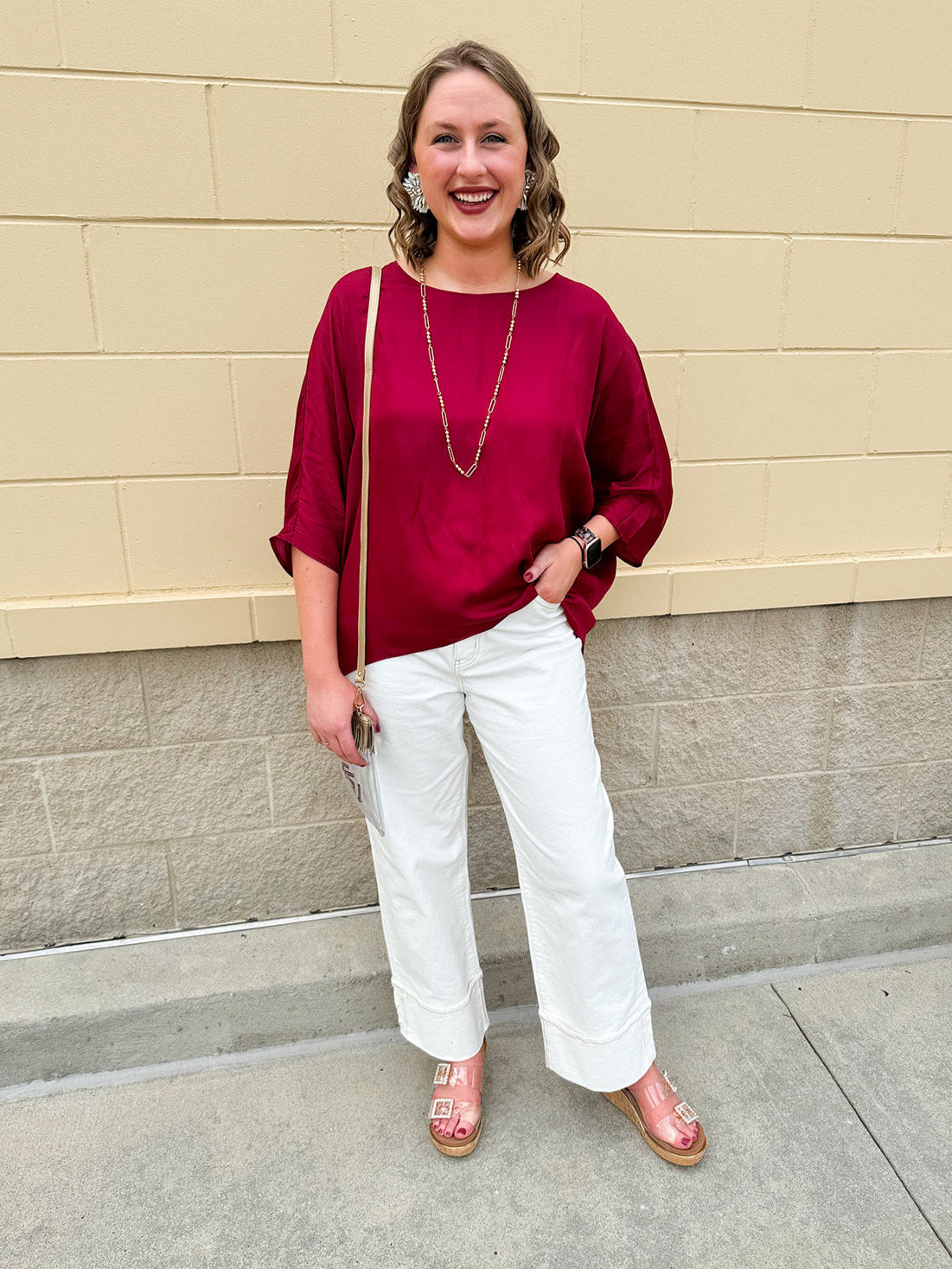 Satin dolman sleeve blouse with a round neckline, shown in a gameday-ready, lightweight and flowy style.