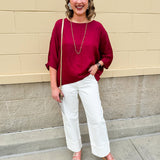 Satin dolman sleeve blouse with a round neckline, shown in a gameday-ready, lightweight and flowy style.