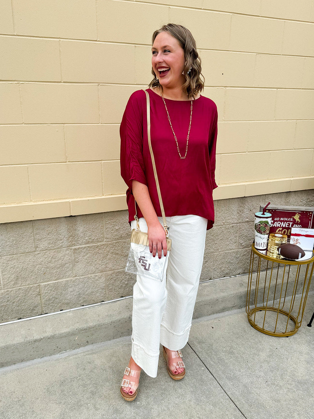 Satin dolman sleeve blouse with a round neckline, shown in a gameday-ready, lightweight and flowy style.