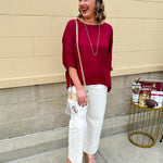 Satin dolman sleeve blouse with a round neckline, shown in a gameday-ready, lightweight and flowy style.