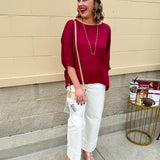 Satin dolman sleeve blouse with a round neckline, shown in a gameday-ready, lightweight and flowy style.