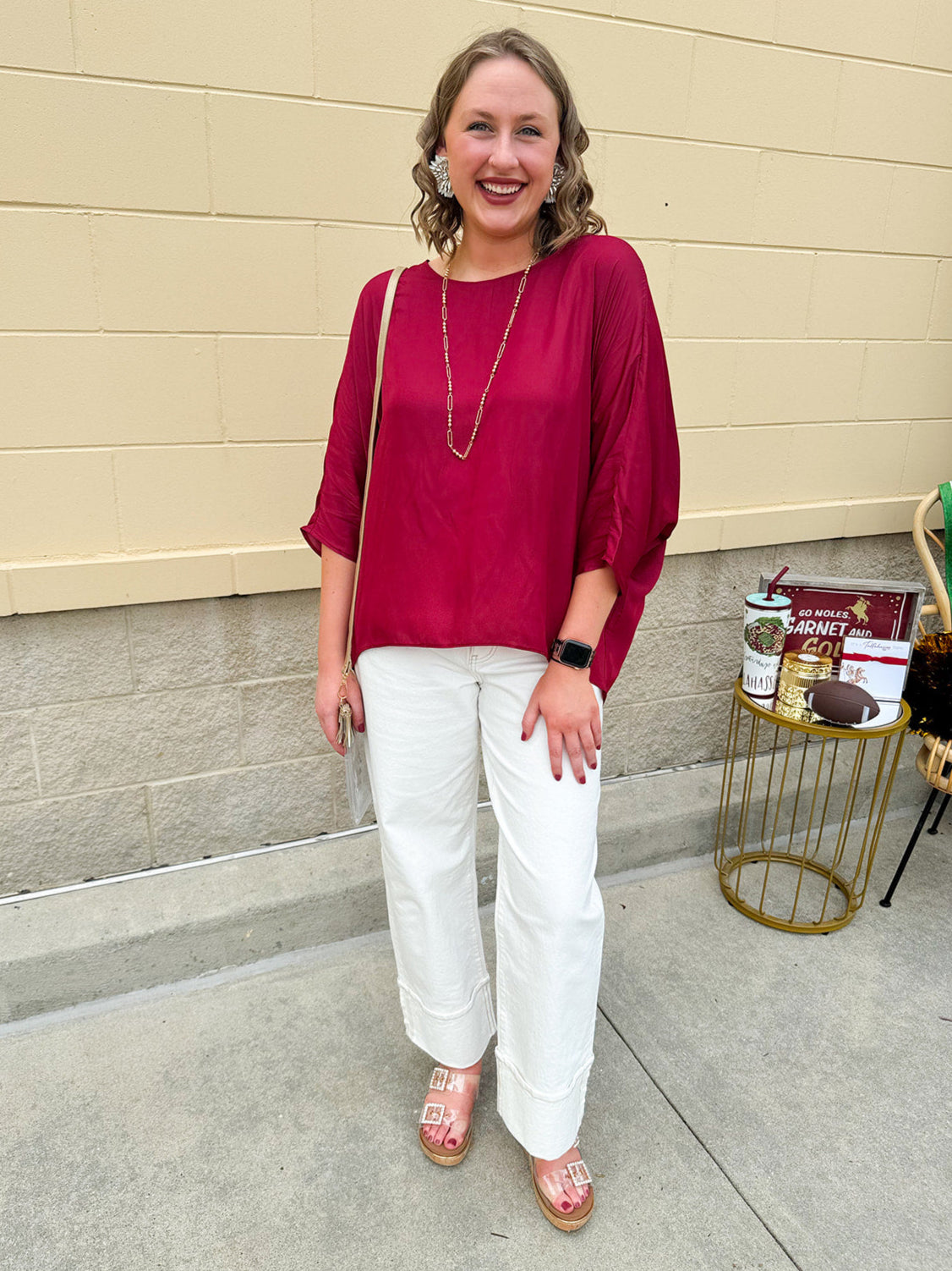 Satin dolman sleeve blouse with a round neckline, shown in a gameday-ready, lightweight and flowy style.