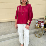 Satin dolman sleeve blouse with a round neckline, shown in a gameday-ready, lightweight and flowy style.
