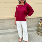 Satin dolman sleeve blouse with a round neckline, shown in a gameday-ready, lightweight and flowy style.