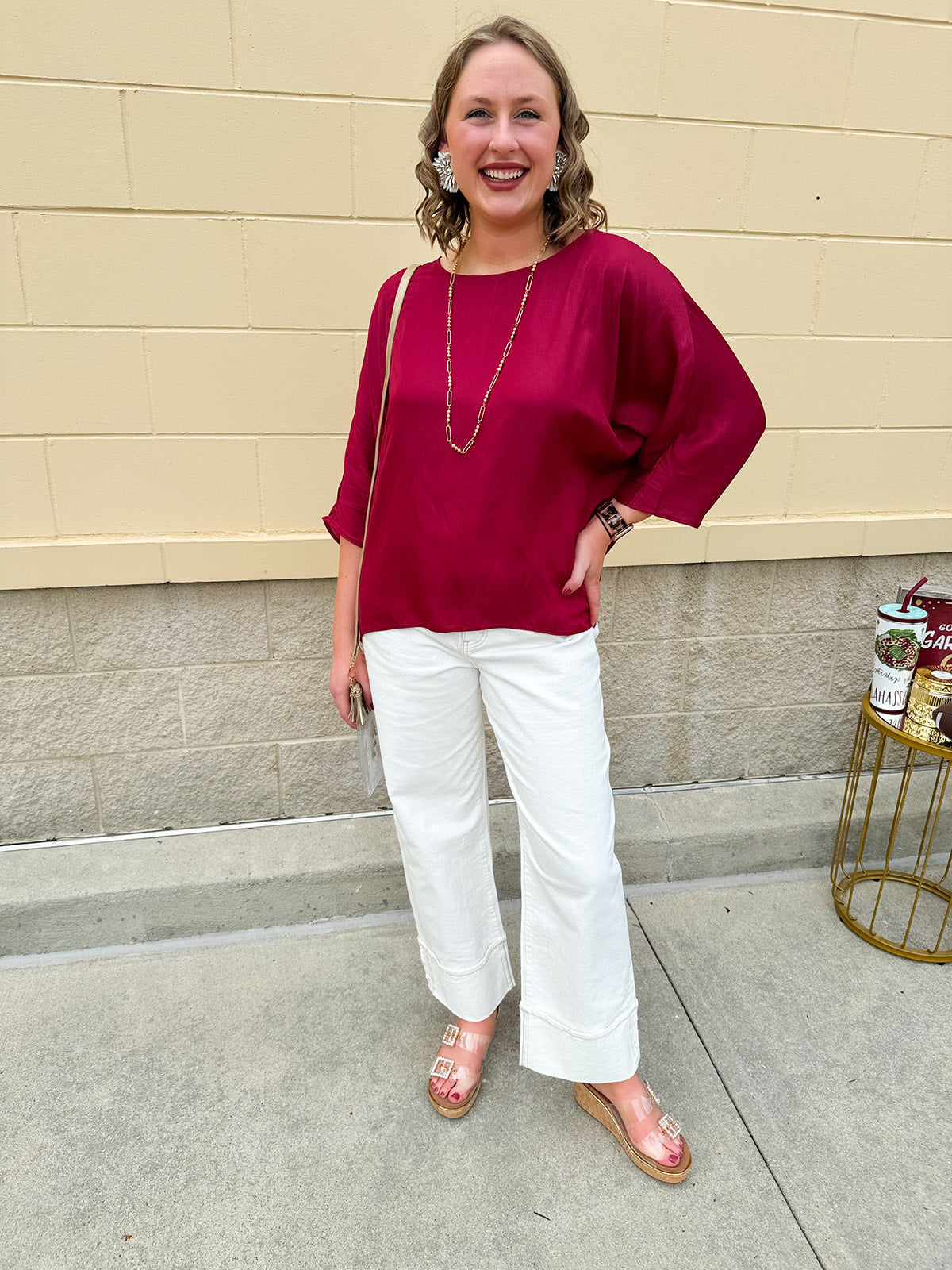 Satin dolman sleeve blouse with a round neckline, shown in a gameday-ready, lightweight and flowy style.