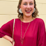 Water-resistant gold necklace with delicate beading and open oval chain, ideal for layering and everyday wear