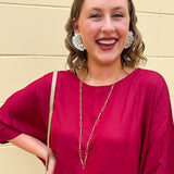 Water-resistant gold necklace with delicate beading and open oval chain, ideal for layering and everyday wear