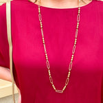 Water-resistant gold necklace with delicate beading and open oval chain, ideal for layering and everyday wear