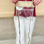 Clear crossbody purse with gold vegan leather, fringe trim, and FSU logo, designed for stadium approval and style.