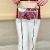Clear crossbody purse with gold vegan leather, fringe trim, and FSU logo, designed for stadium approval and style.