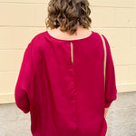 Satin dolman sleeve blouse with a round neckline, shown in a gameday-ready, lightweight and flowy style.