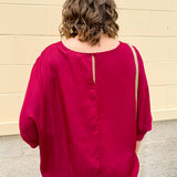 Satin dolman sleeve blouse with a round neckline, shown in a gameday-ready, lightweight and flowy style.