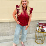 Garnet cotton flutter sleeve top with floral appliqué, ruffle V-neck, and button front—lightweight and perfect for gameday