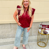 Garnet cotton flutter sleeve top with floral appliqué, ruffle V-neck, and button front—lightweight and perfect for gameday