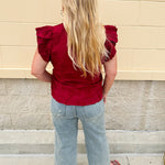 Garnet cotton flutter sleeve top with floral appliqué, ruffle V-neck, and button front—lightweight and perfect for gameday