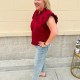 Garnet cotton flutter sleeve top with floral appliqué, ruffle V-neck, and button front—lightweight and perfect for gameday