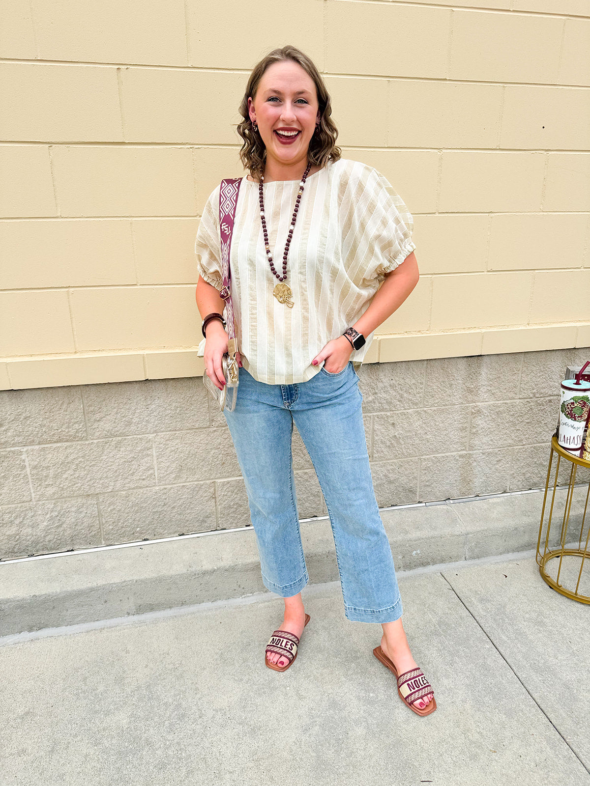 Light wash mid-rise flare jeans with frayed hem and flattering fit, styled for casual and chic everyday looks.