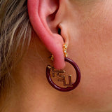 Gold hoop earrings with FSU garnet and gold enamel logo charms
