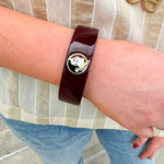 Garnet marbled resin cuff bracelet with gold FSU logo detail