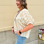 Cream and gold striped round-neck top with dolman sleeves and elastic cuffs, styled for summer.