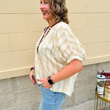 Cream and gold striped round-neck top with dolman sleeves and elastic cuffs, styled for summer.