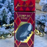 Charcoal massaging soap bar in product packaging.