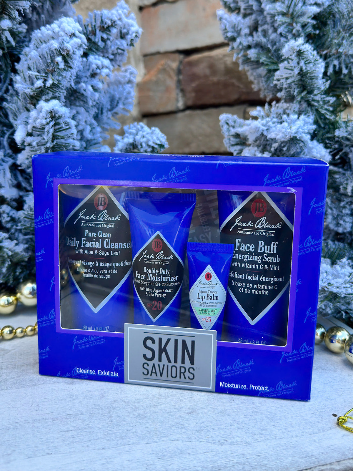 Jack Black facial care gift set with cleanser, scrub, moisturizer, and lip balm