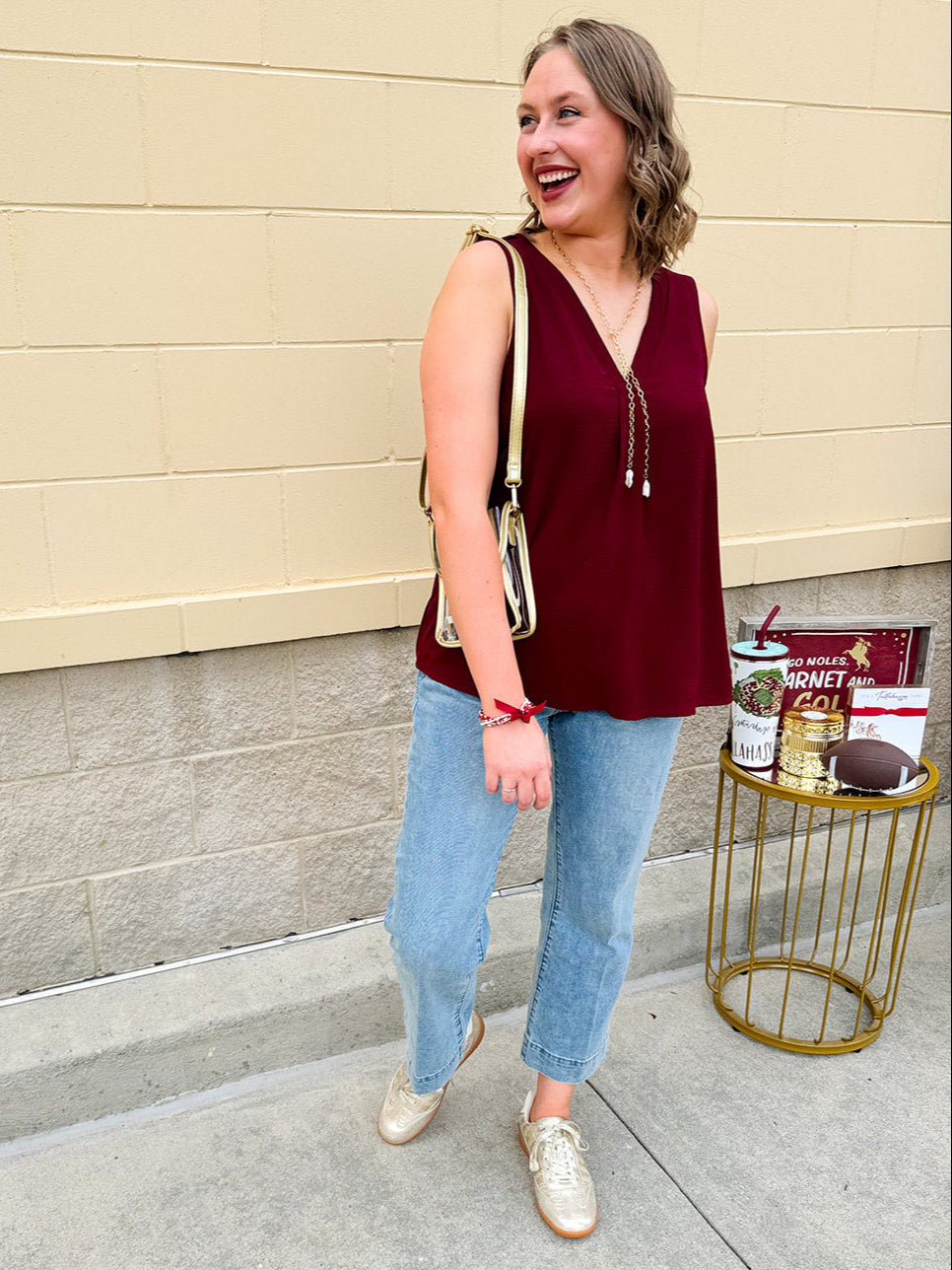 Garnet sleeveless V-neck tank with pleated detail at neckline, made in USA fabric.
