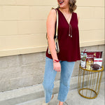 Garnet sleeveless V-neck tank with pleated detail at neckline, made in USA fabric.