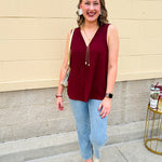 Garnet sleeveless V-neck tank with pleated detail at neckline, made in USA fabric.