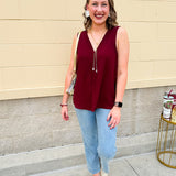 Garnet sleeveless V-neck tank with pleated detail at neckline, made in USA fabric.
