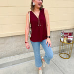 Garnet sleeveless V-neck tank with pleated detail at neckline, made in USA fabric.