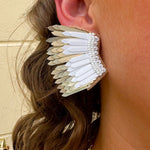 Layered feather-style earrings with white and gold sculpted plastic pieces. Bold, lightweight, and perfect for standout Gameday style.
