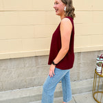 Garnet sleeveless V-neck tank with pleated detail at neckline, made in USA fabric.