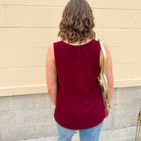 Garnet sleeveless V-neck tank with pleated detail at neckline, made in USA fabric.
